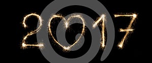 New year date, sparkler numbers on black background