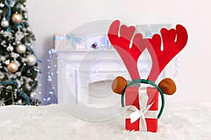 New Year. Decorated room no people present with deer antlers close-up blurred background