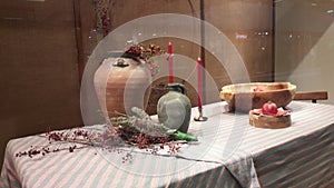 New Year decoration with branches, vases and red candles in in store window in shoping mall Usce, New Belgrade