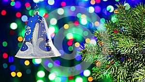 New Year decorations bell on blinking bokeh background