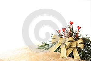 New Year decorations with bows and hearts. White, golden and red colors, natural branches of pine. Festively decorated Christmas