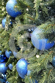 New year decorations shiny blue balls on christmas tree