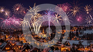 New year eve firework and Illuminated houses in Seiffen at Christmastime. Saxony Germany