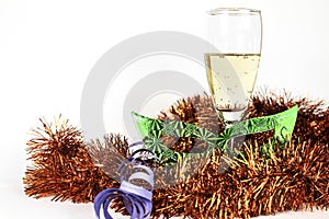 New Year Eve party favors next to glass of Champagne