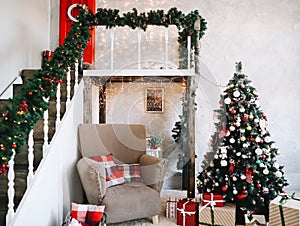 New Year festive interior. Holiday concept. Decorated Christmas tree with gifts. Decorated Christmas porch.