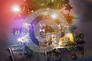 new-year fir tree is decorated with the 100 dollars. hundred-dollar bills laid out on the branches of the Christmas tree as a gift