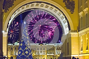 New Year fir-tree in garlands of fires at Palace Square and Christmas fireworks, St. Petersburg, Russia