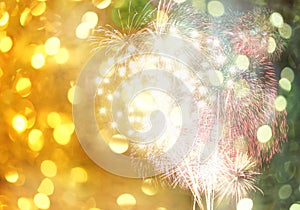 New year fireworks on golden bokeh background and have copy space.