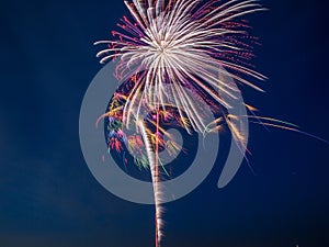 ColorfulfFireworks burst in the night sky with light trails