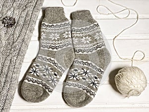 New year flat lay layouts. Knitted socks with a pattern