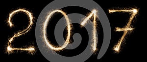 New year font sparkler numbers on black background