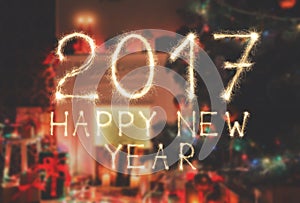 New year font sparkler numbers on room background