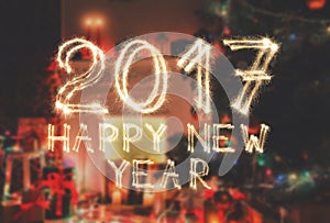 New year font sparkler numbers on room background