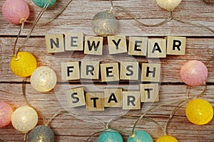 New Year Fresh Start alphabet letter on wooden background