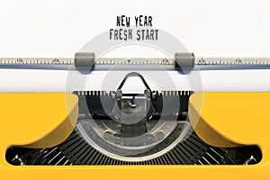 New year fresh start typed on Yellow typewriter.
