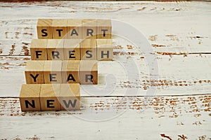 New Year Fresh Start Word alphabet letters on wooden background