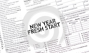 NEW YEAR FRESH START words on paper sheet with documents