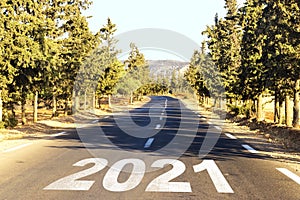 New Year Goals Concept : Empty asphalt road sunset and Happy New Year 2021 in Algeria