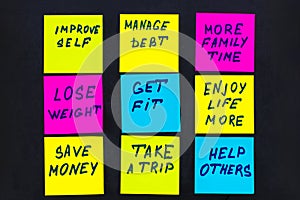 New year goals or resolutions - colorful sticky notes on a black