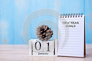 New Year goals word on notebook  and January calendar. time for a New start, resolution, Plan, Action and Mission Concept