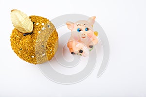 New year gold apple toy pig white background