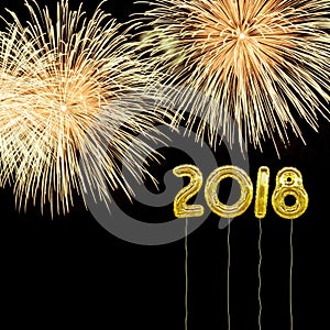 New Year 2018 with gold foil style balloons and fireworks.