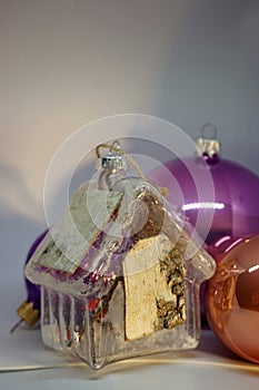 New year house glass toy. Christmas decorations, Holiday background, template for greeting card. Vertical