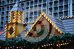 New Year illuminations of rustic pavilion with tower at Christmas fair in Berlin Germany