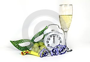 New Year at Midnight. Clock at twelve o'clock with glass of champagne