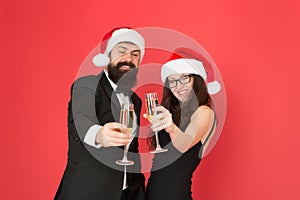 New year new goals. business man and girl drink champagne. xmas party. formal couple in love celebrate new year. tuxedo