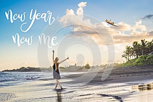 NEW YEAR NEW ME concept A young woman launches a kite on the beach. Dream, aspirations, future plans