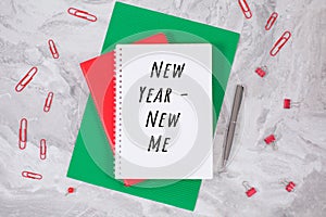 New year - new me and notebook on a table