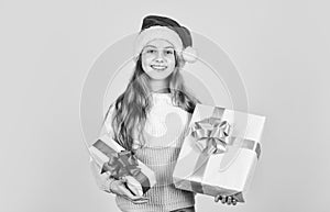 New year new me. time for discount. smiling kid hold purchase. presents and gifts santa claus. small girl santa at
