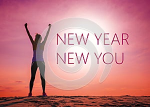 New year new you text quote on the image of womans silhouette at sunrise