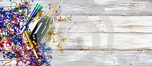 New Year party decorations and champagne on rustic white wood