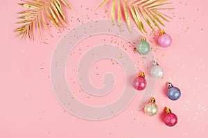 New Year pink copy space background with Christmas golden balls