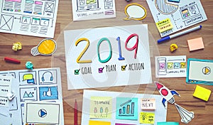 2019 new year resolutions with business digital marketing and paperwork sketch on wood table.analysis strategy concepts
