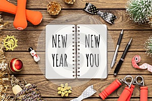 New year resolutions or goals for healthy lifestyle, lose weight and join gym concept. New Year New You written in notebook with