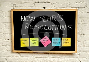 New Year resolutions or popular Goals and colorful sticky post its notes on chalk blackboard