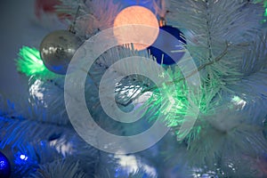 New Year`s background - Christmas tree decorated with garlands, close-up