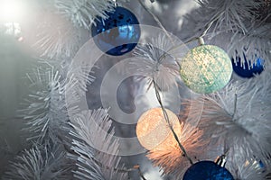 New Year`s background - Christmas tree decorated with garlands, close-up