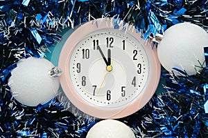 New Year`s clock decorated with christmas ball. Celebration Concept for New Year Eve