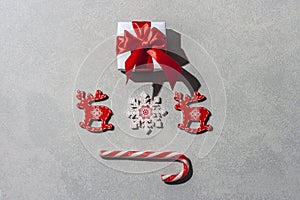 New Year`s composition. Christmas decorations on gray background with hard shadow and copy space