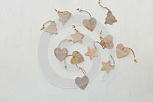 New Year`s composition. Christmas composition. Wooden decorations for the Christmas tree on a white texture background