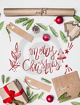 New Year`s concert, wrapped gift, wrapping paper, Christmas tree branches and toys on a white background with the inscription