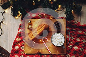 New Year`s dinner with cocoa and croissants near the Christmas tree