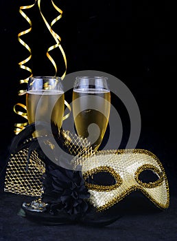 New Year`s Eve carnival mask and champagne