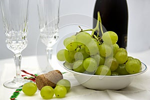 New Year's Eve celebration with lucky grapes and champagne or cava