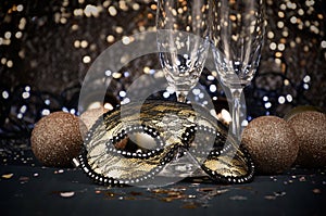 New Year`s Eve celebration party with champagne glasses and golden carnival mask stock images