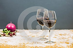 New year's eve cheers with two glasses of red wine and grapes